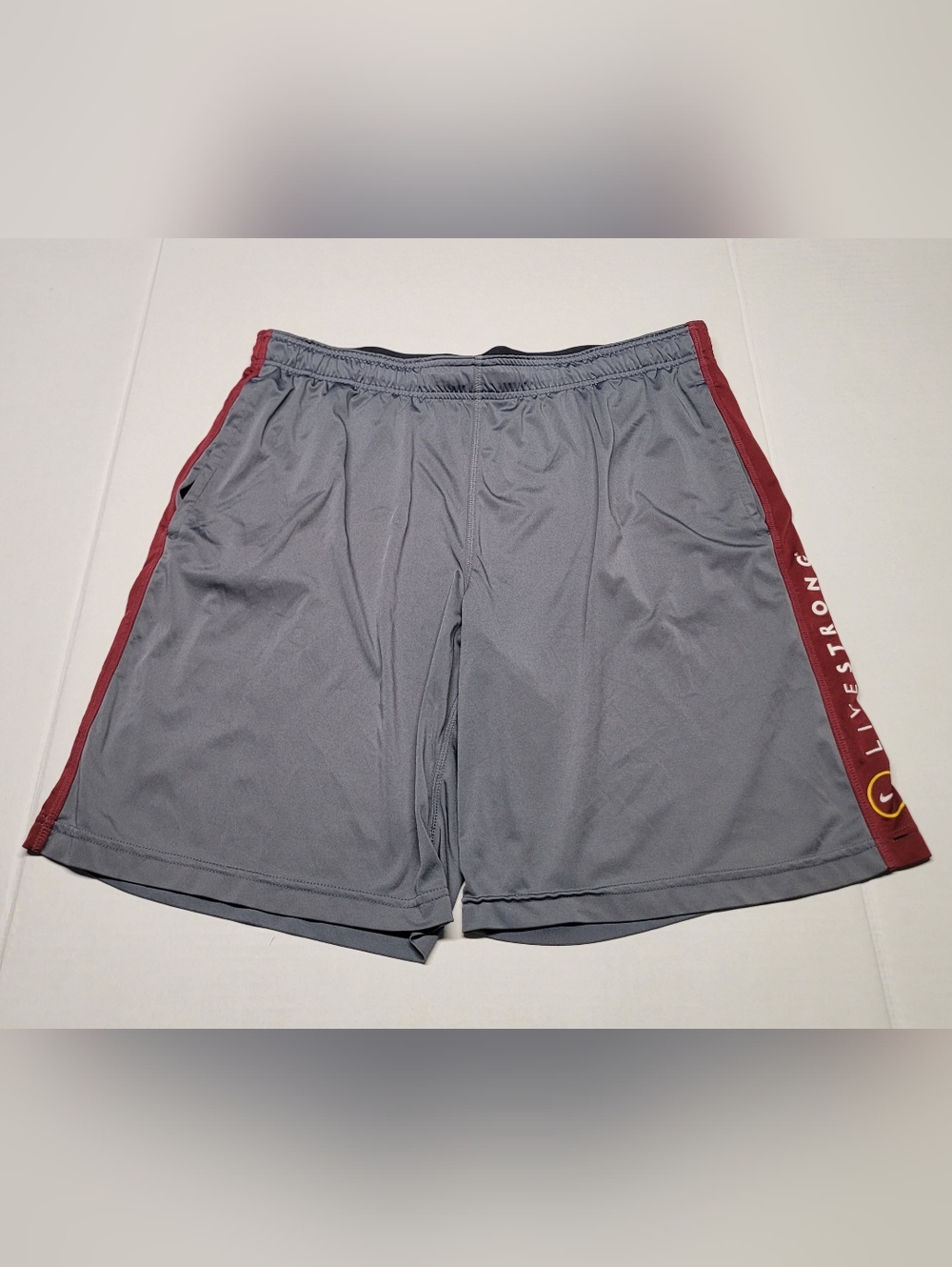 Nike Men's Gray Athletic Shorts with Red Side Panels